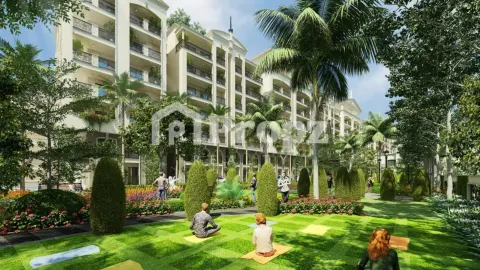 Landscaped garden area with residents practicing yoga on lawn surrounded by palm trees and residential buildings