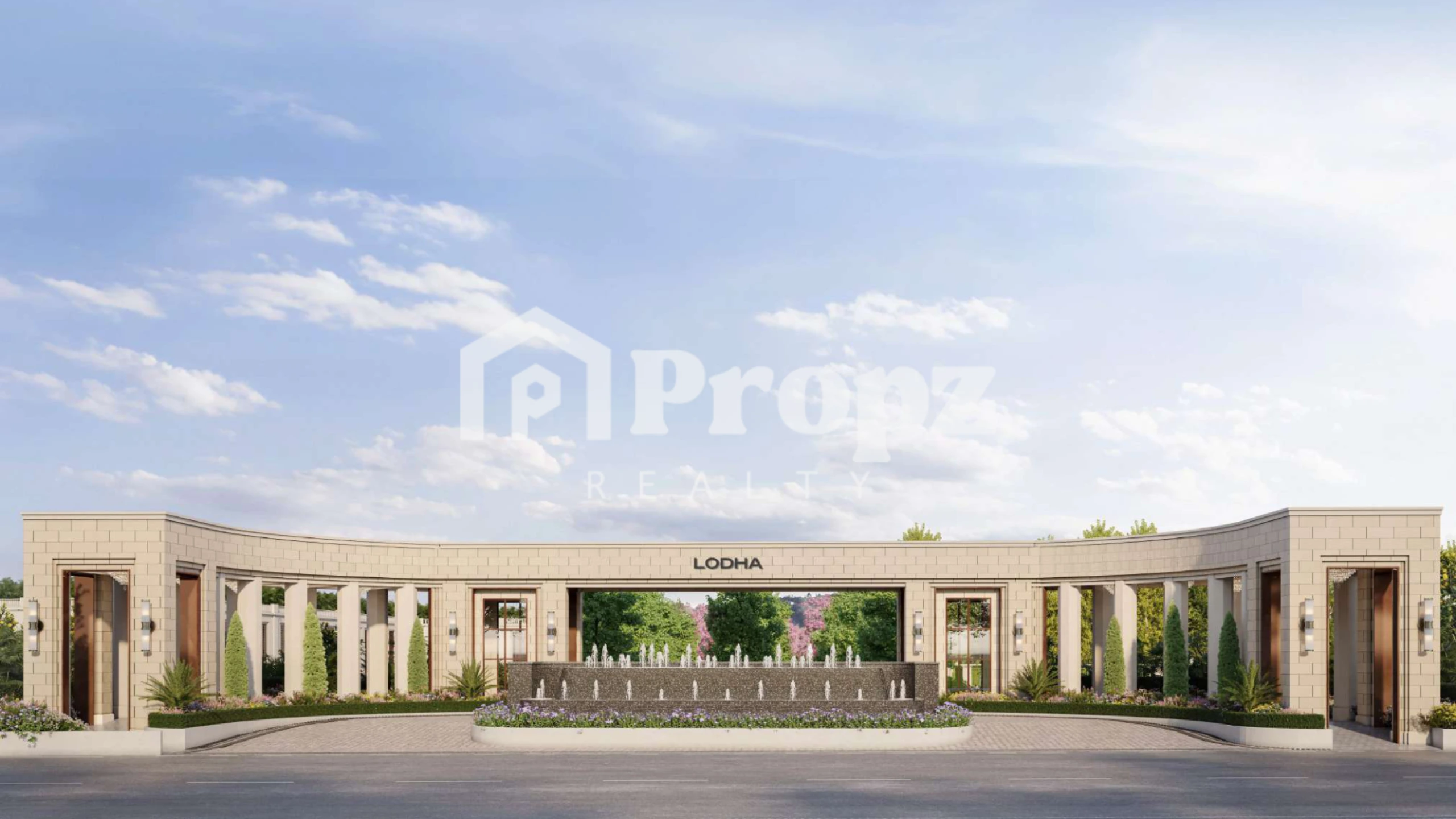 Grand entrance gate of Lodha Beaumont Estate with beige stone facade, columns, and landscaped fountains