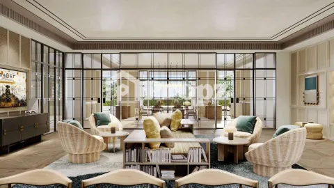 Elegant clubhouse lounge with wicker chairs, glass partitions, and views of outdoor terrace