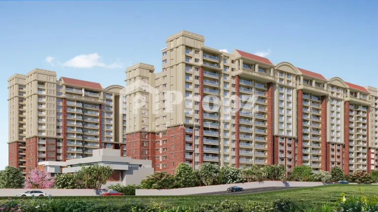 Front elevation of Brigade Insignia residential towers with beige and brick facade in Yelahanka