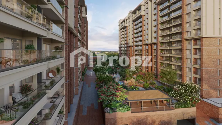 Landscaped courtyard view between apartment towers showing garden pavilion and planted balconies