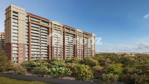 Side view of Brigade Insignia apartment building with landscaped gardens and red roof accents