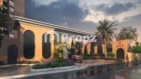Landscaped courtyard entrance with arched gateway between residential towers at Sumadhura Solea