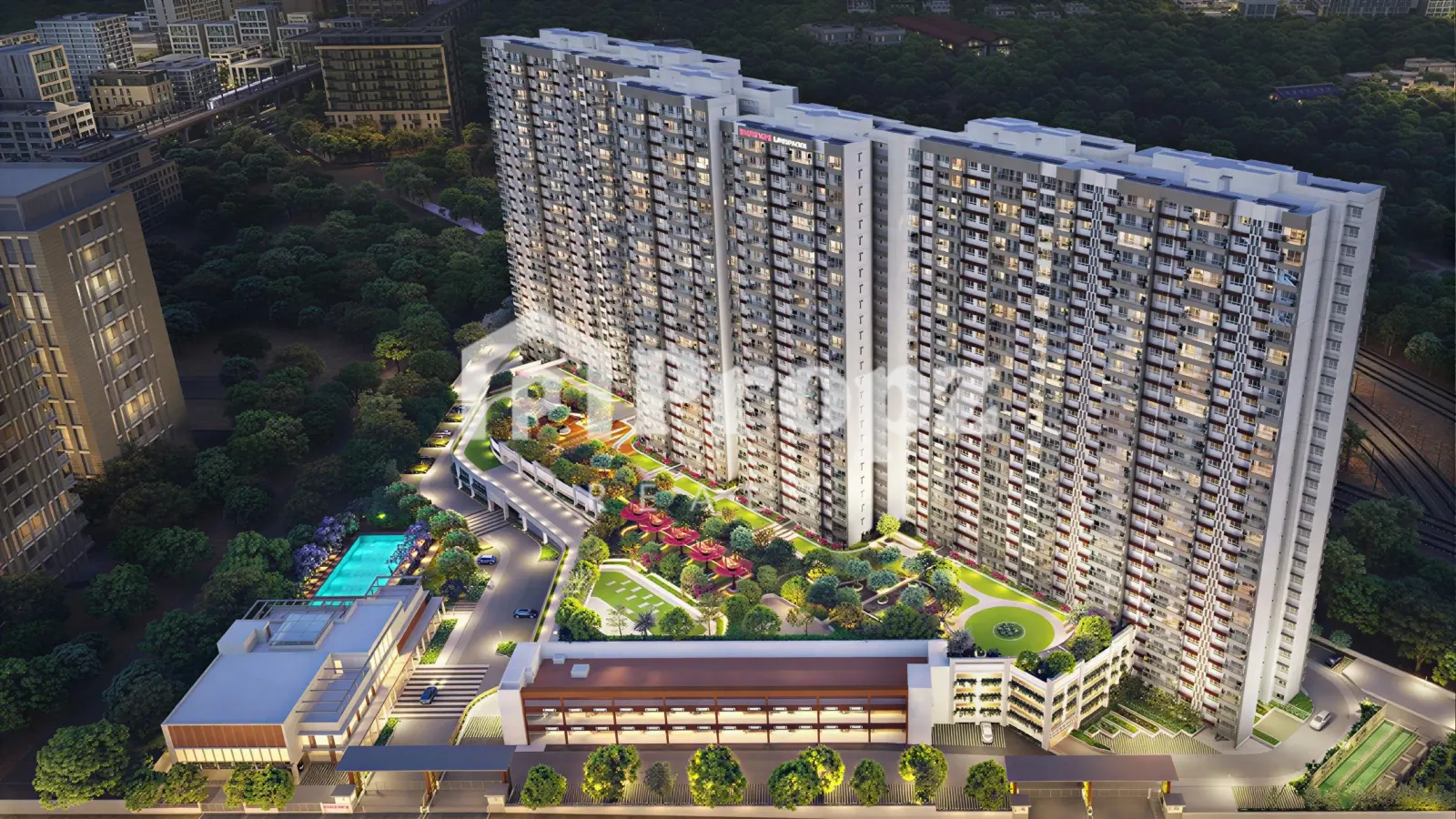 Aerial view of Mahindra Blossom high-rise residential towers with landscaped podium and swimming pool