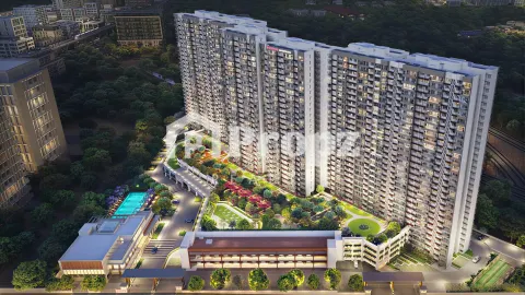 Aerial view of Mahindra Blossom twin towers with landscaped podium deck and pool area in Whitefield