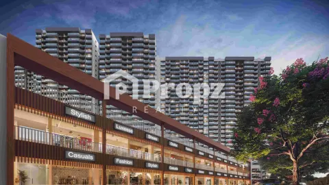 Ground level view of Mahindra Blossom retail area with residential towers in background