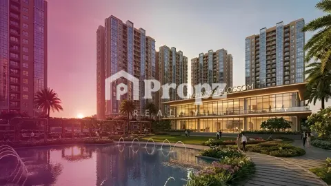 Mahindra Blossom clubhouse and residential towers at sunset with water feature and landscaped gardens