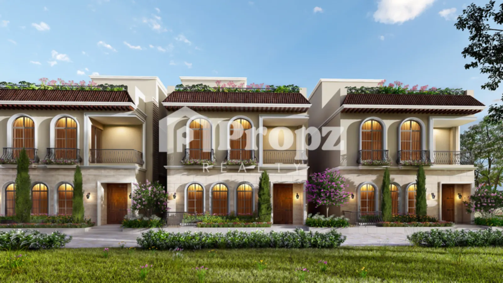 Two-story Mediterranean-style townhomes with arched windows, red tile roofs, and landscaped front yards