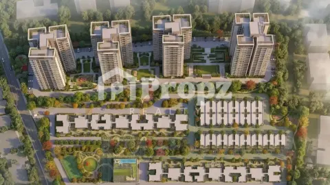 Aerial view of Bhartiya Nikoo Homes 8 master plan showing residential towers and low-rise villas