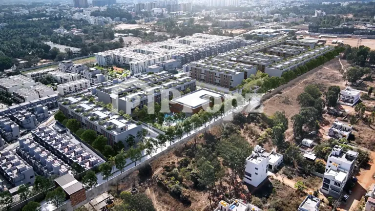 Aerial view of Assetz Mizu and Ki residential development showing multiple low-rise buildings and green spaces