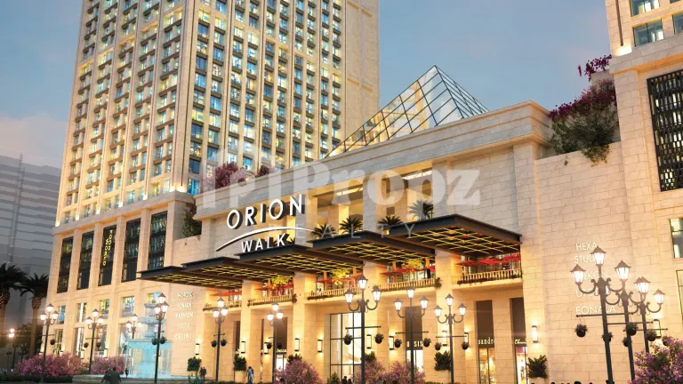 Orion Walk retail facade with illuminated signage and residential tower at Brigade Granada