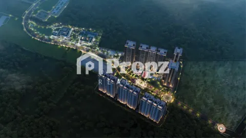 Aerial view of Nambiar District 25 Phase 2 residential complex surrounded by green landscape