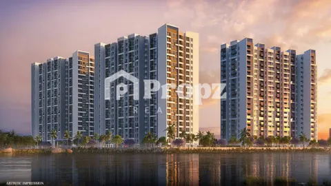 Lakeside view of Sumadhura Folium towers at dusk with illuminated facades