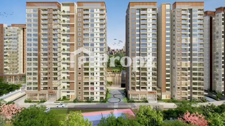 Front elevation of Sumadhura Solace showing multiple high-rise towers with outdoor sports court