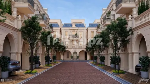 Interior courtyard view at Godrej Florenne with paved driveway and landscaped trees between townhomes