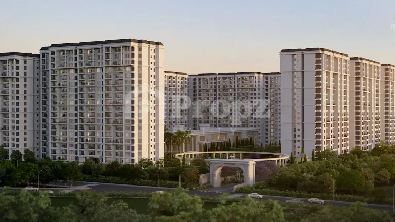 Street-level view of Sumadhura Edition Phase 2 residential towers with entrance gate and landscaping at dusk