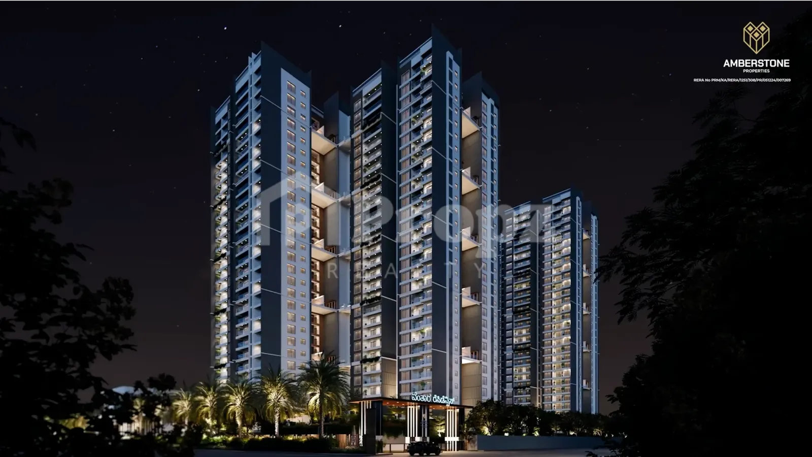 Night view of Amberstone Ventara Residences high-rise towers with illuminated balconies and landscaped entrance