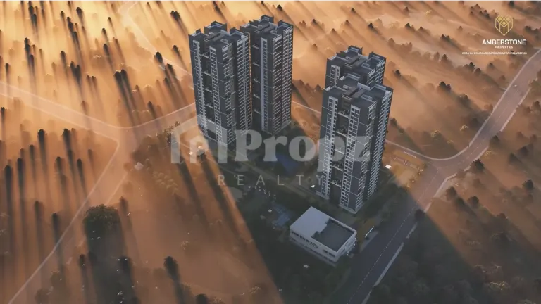 Aerial view of Amberstone Ventara Residences towers surrounded by greenery at sunrise