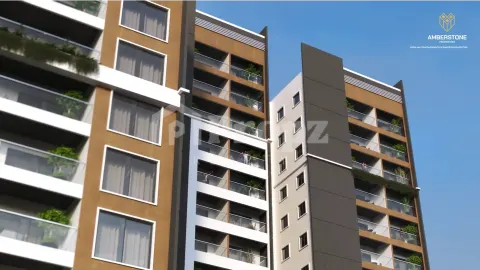 Close-up of residential building facade with balconies featuring brown and white architectural details