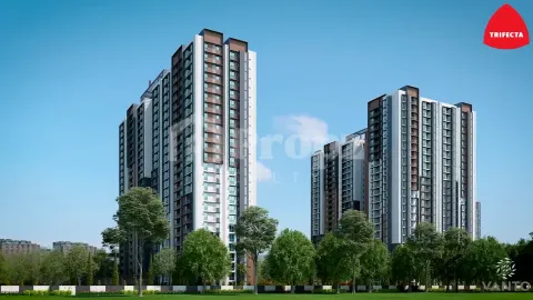 Front view of Trifecta Vanto high-rise residential towers with landscaped green spaces