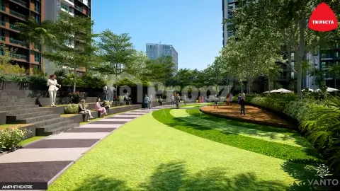 Landscaped amphitheater with tiered seating and green lawn area between residential buildings
