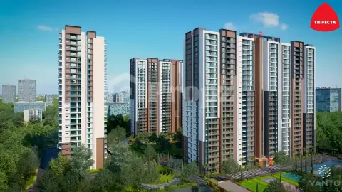 Multiple residential towers of Trifecta Vanto with varied facade designs and surrounding greenery