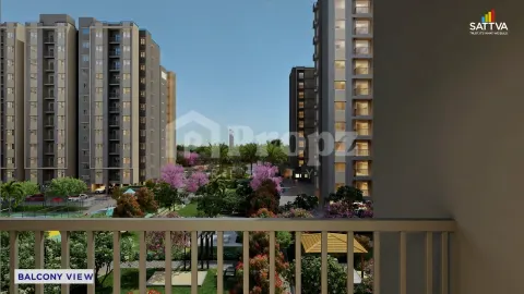Balcony view overlooking landscaped gardens and residential towers at Sattva Aeropolis